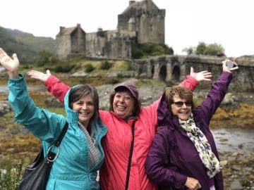 Three women at Eilean Donan Castle